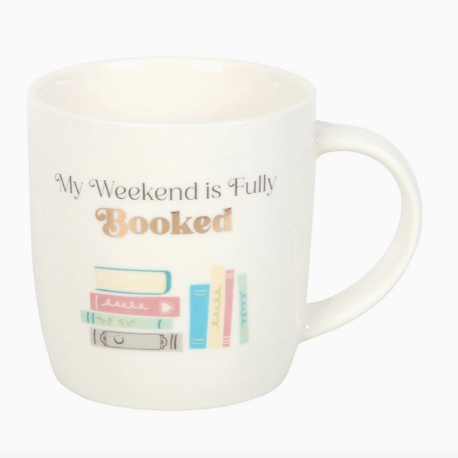 White mug with 'My Weekend is Fully Booked' text and book illustrations on a white background