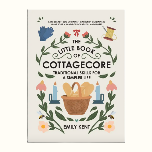 Book cover of 'The Little Book of Cottagecore' by Emily Kent with illustrations of a basket, flowers, and candles.