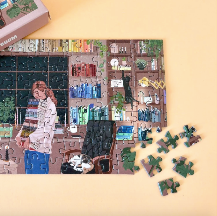 Jigsaw puzzle of a woman in a library with completed pieces on a beige background