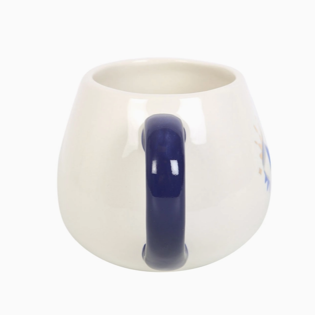 White mug with a blue handle on a white background