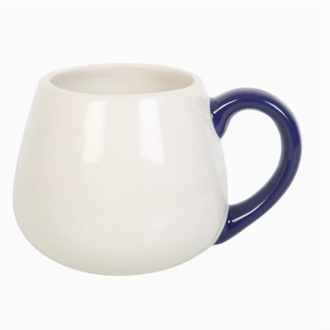 White mug with a blue handle on a white background