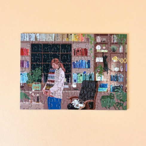 mini puzzle of a person in a room with books and plants on a beige background