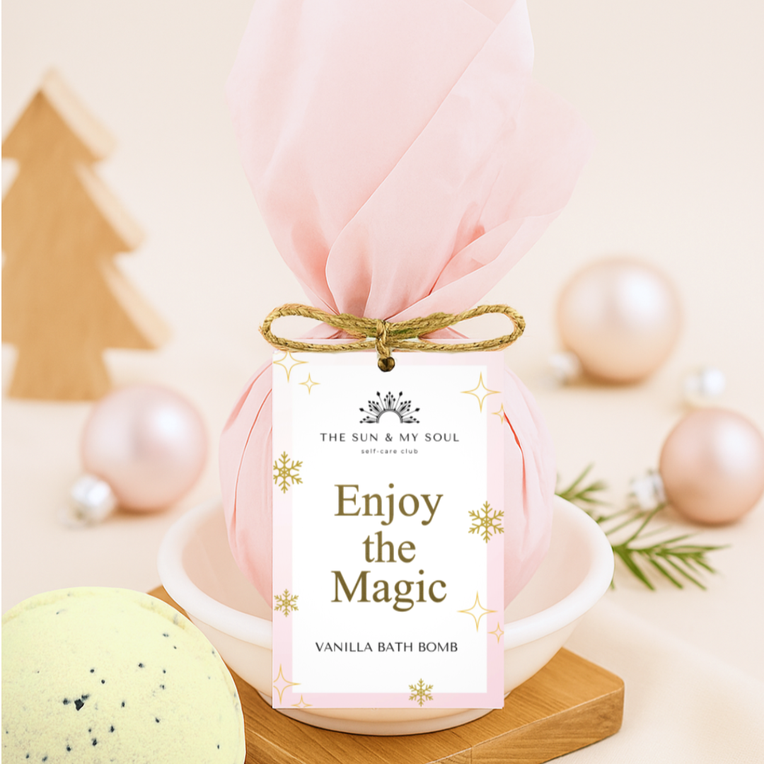 Vanilla bath bomb with packaging labeled 'Enjoy the Magic' on a decorative background.