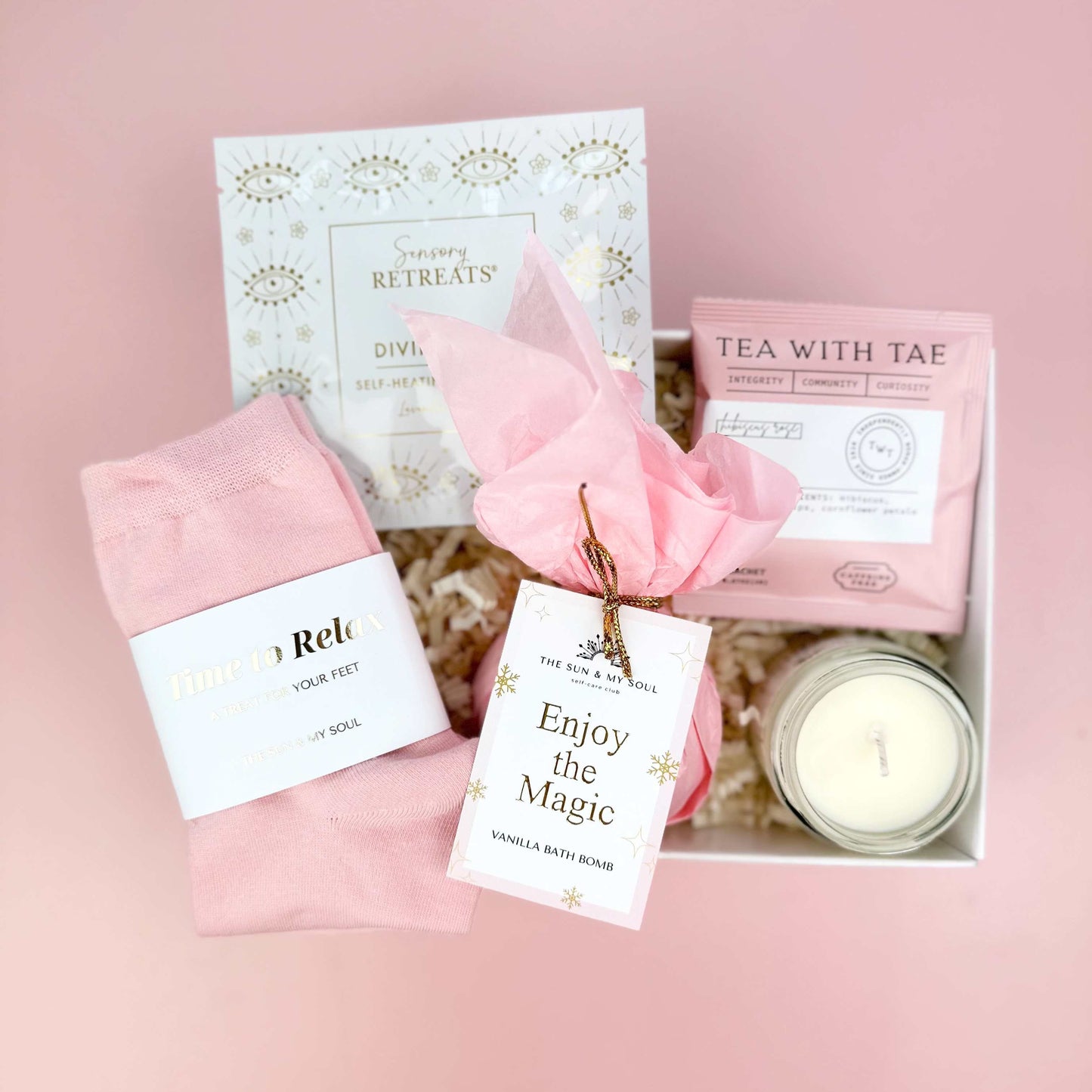 Gift set with pink items on a pink background