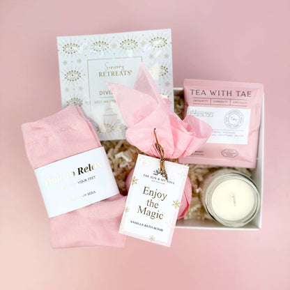 Gift set with pink items on a pink background