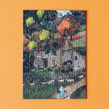 Jigsaw puzzle with a partially completed scene on an orange background